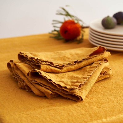 Linen table set in saffron